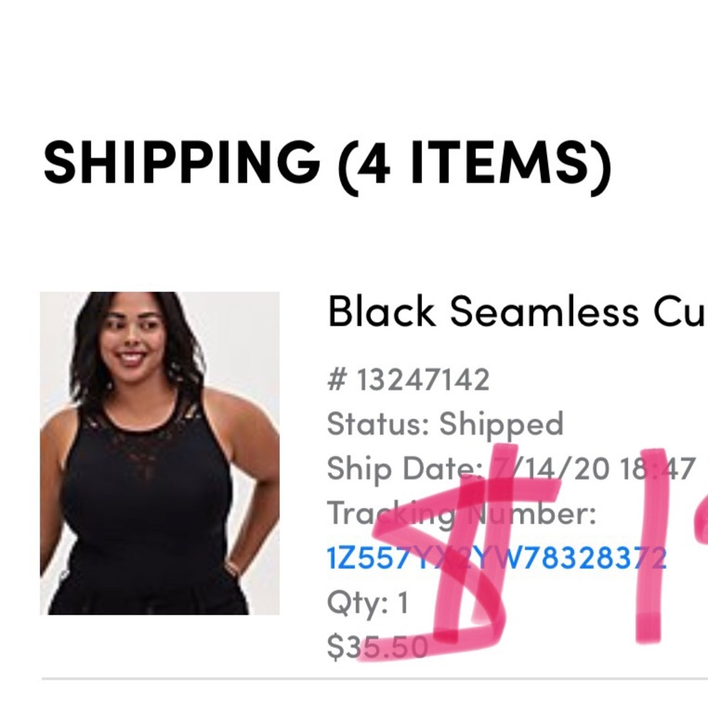 Black cut-out tank from Torrid. Cut-out detailings around collar